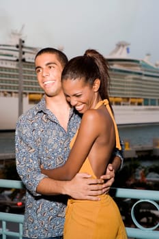 Young man and a teenage girl embracing each other