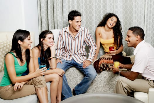 Group of friends talking to each other and smiling