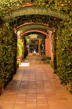 Signboard on the arch of a trellised walkway