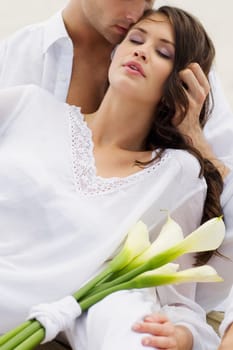 Close-up of a young man kissing a young woman