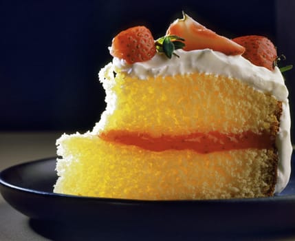 Close-up of a piece of eaten cake on a plate