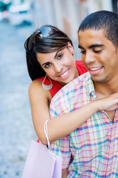 Close-up of a teenage girl embracing a young man from behind