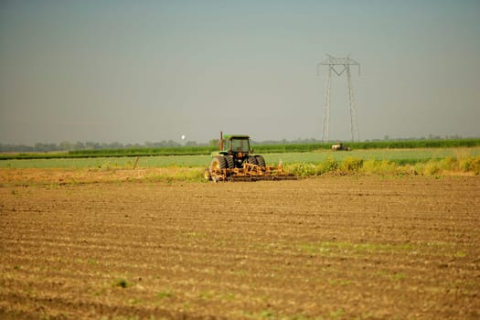 Tractor plowing a farm