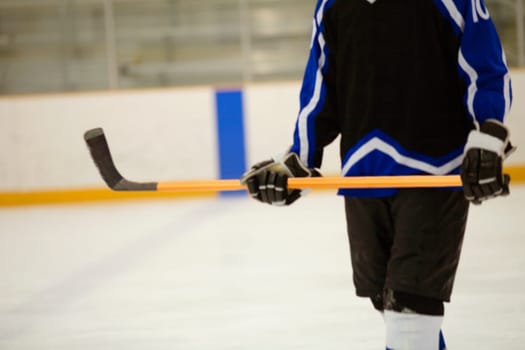 Mid section view of an ice hockey player