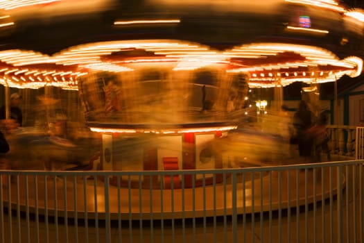 Close-up of a carousel at night
