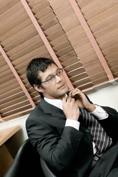 High angle view of a businessman adjusting his tie