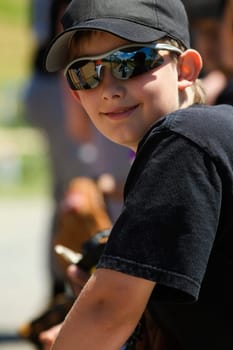 Close-up of a baseball player wearing sunglasses and smiling