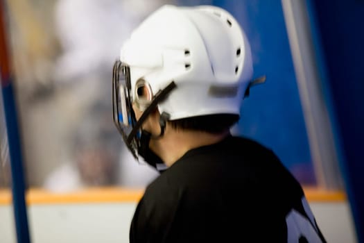 Side profile of an ice hockey player wearing a helmet