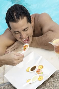 High angle view of a young man eating food