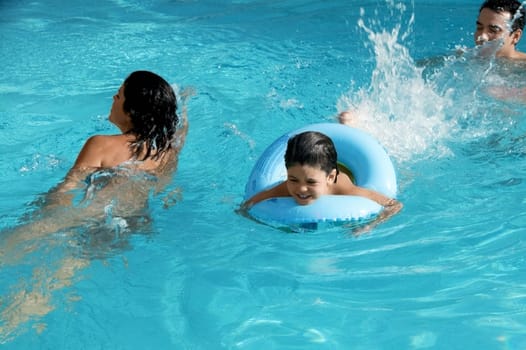 High angle view of a family in a swimming pool