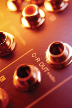 Audio equipment with holes for cables, close-up