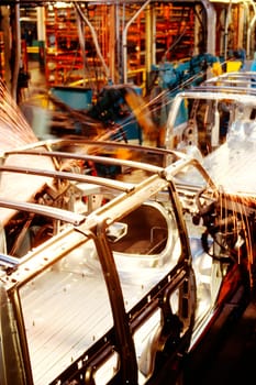 Robots welding a row of cars in an assembly line, Baltimore, Maryland, USA