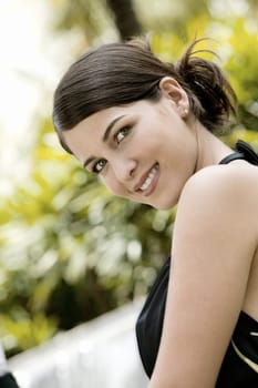Side profile of a young woman smiling