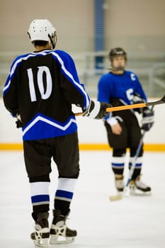 Close-up of two ice hockey players playing ice hockey