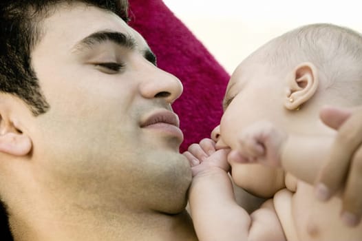 Close-up of a father with his daughter