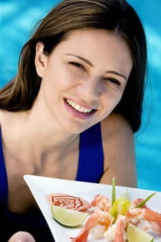 Portrait of a young woman holding a tray