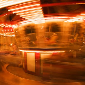 Close-up of a carousel at night