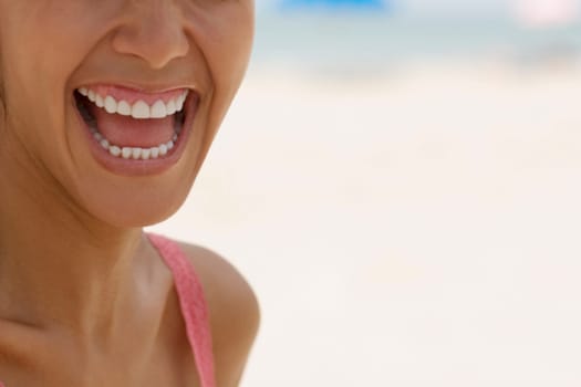 Close-up of a young woman laughing