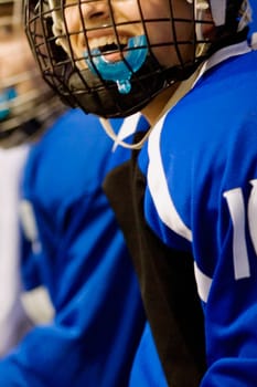 Close-up of an ice hockey player wearing a helmet and smiling