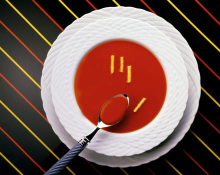 High angle view of a spoon in a bowl of tomato soup
