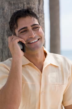 Close-up of a young man using a mobile phone