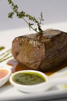 Close-up of meat loaf with a spoon full of gravy in a plate