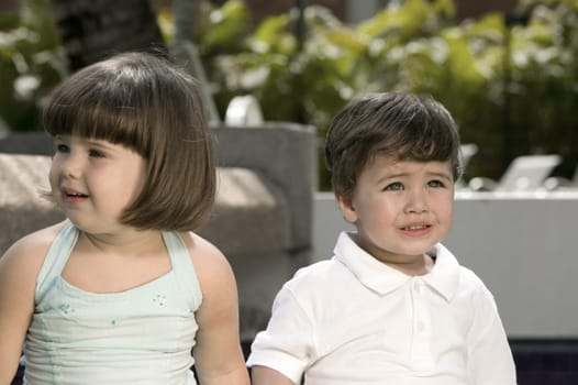 Close-up of a boy and a girl crying