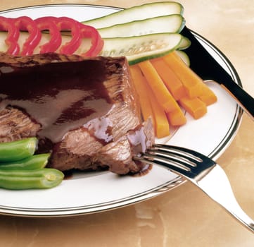 Close-up of meat and vegetables in a plate