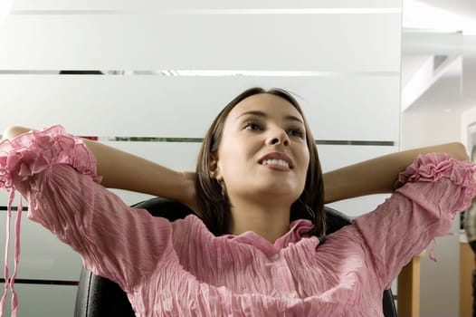 Close-up of a businesswoman sitting on a chair