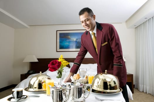 Waiter serving food