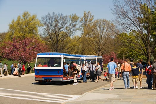 Commuters boarding a bus on the road