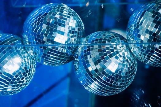 Low angle view of disco balls