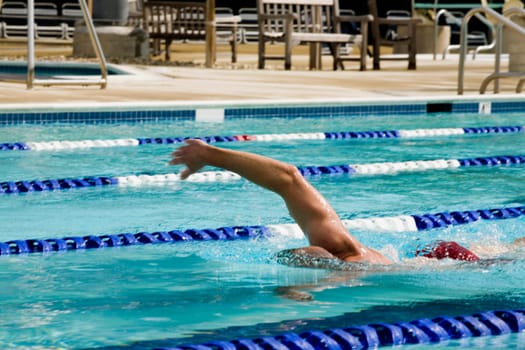Man swimming in a swimming pool