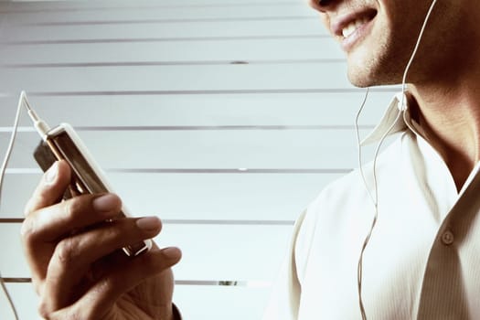 Close-up of a young man listening to music