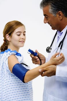 Side profile of a male doctor measuring blood pressure of a young woman