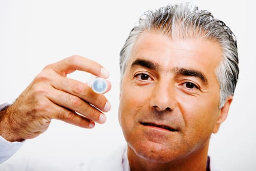Portrait of a male doctor holding a syringe