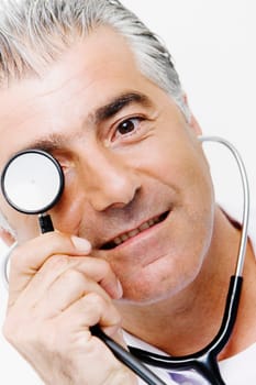 Portrait of a male doctor holding a stethoscope in front of his eyes