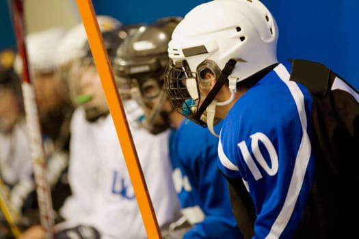 Side profile of a group of ice hockey players in uniforms