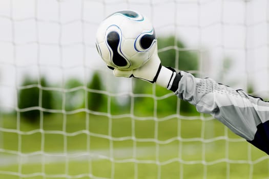 Close-up of a goalieŽs hand making a save