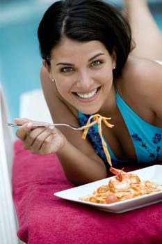 Portrait of a young woman having a meal