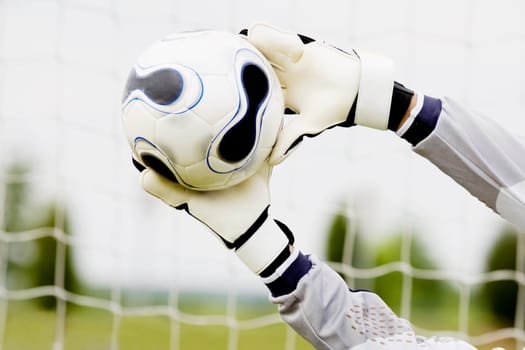 Close-up of a goalieŽs hands making a save