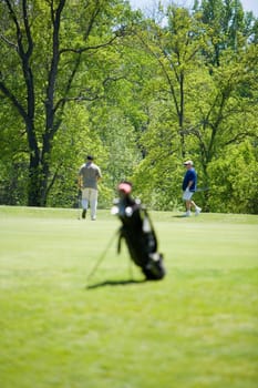 Two men walking on a golf course