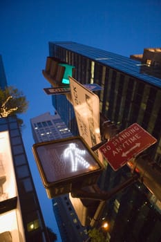 Low angle view of a walk signal at night