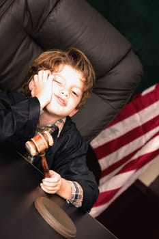 Boy imitating a judge