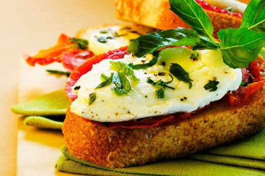 Close-up of cheese and herbs on bread