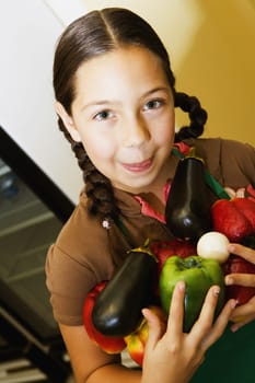 Portrait of a girl holding vegetables