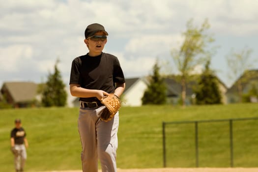 Baseball player walking in a baseball field
