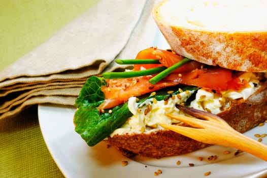 Close-up of a ham sandwich on a plate