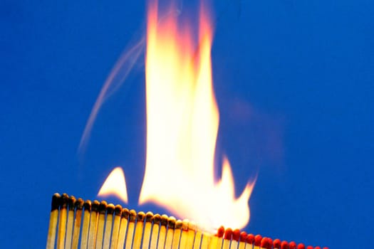 Close-up of burning matchsticks