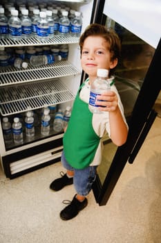 Boy holding a water bottle